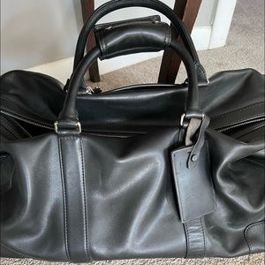 Coach black leather travel bag in excellent condition. Only used a few times.